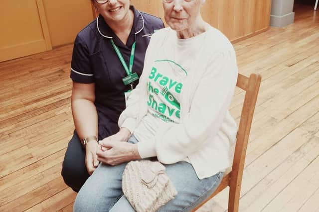 She did it! Maria with a Macmillan nurse who went along to support her.