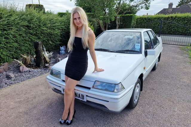 Amy Coupland, of Fishtoft, with the old Proton Saga used in the viral video.