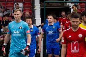 The Teams take to the field, at Ashton United's Hurst Cross