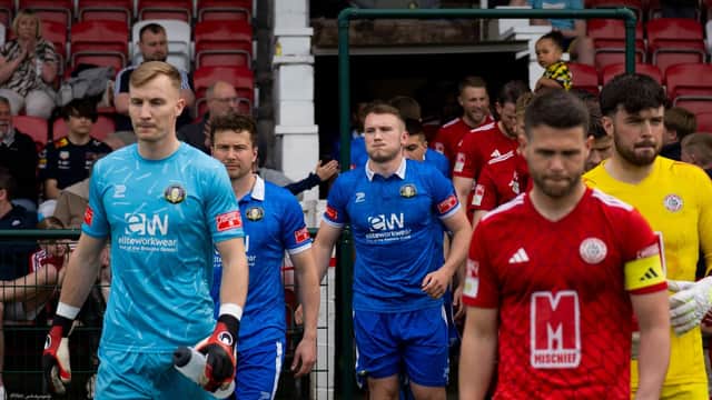 The Teams take to the field, at Ashton United's Hurst Cross
