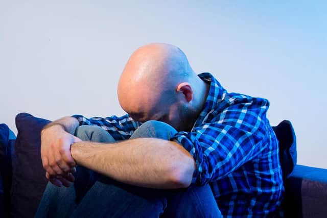 PICTURE POSED BY MODEL A man showing signs of depression.