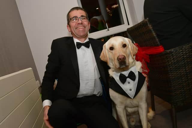 Relative of a resident, Iain Haybittle with his dog Vinnie in black tie!