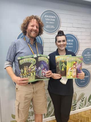 Dr Rob McElroy delivering comics to Mrs Moore, Year 6 teacher and science lead from Birchwood Junior School