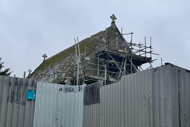 Scaffolding goes up to save the church building.