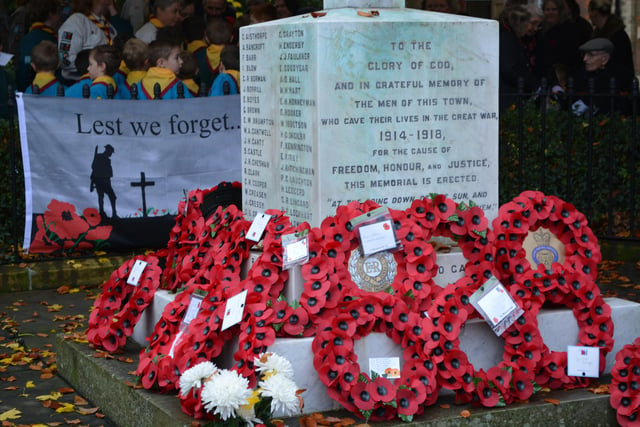 Poppy wreaths adorn the war memorial