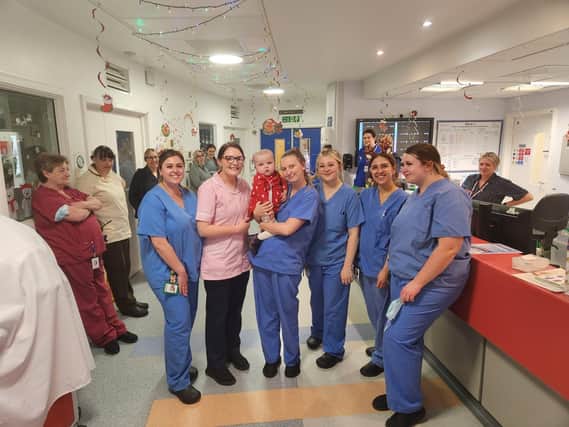 Olivia with the staff at Newcastle Children's Hospital being discharged.