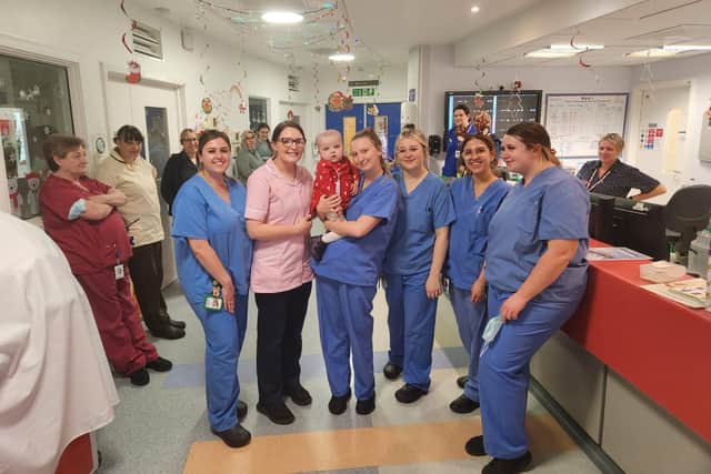 Olivia with the staff at Newcastle Children's Hospital being discharged.