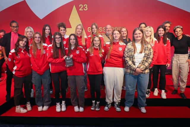Horncastle Town's U15 girls on stage receiving their award with England legends Rachel Yankey (back left) and Sue Smith (right).