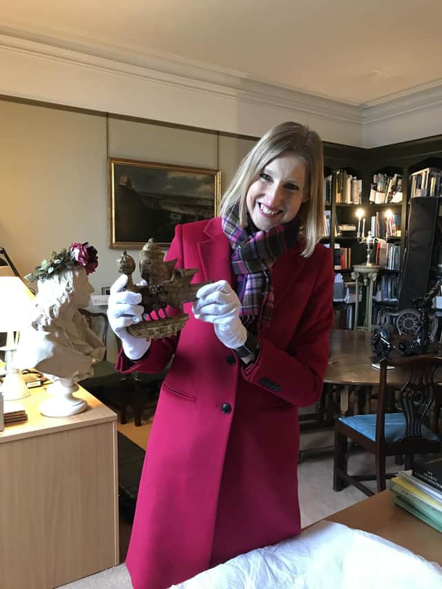 Dr Tracy Borman holding Anne Boleyn's newly-discovered falcon.