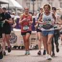 Tammy Studholme, of Boston, completing her 10th marathon, all of which have been for good causes.