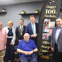 'We salute you!': Alfred Conway (centre) with (from left) his son-in-law Andrew Pretty and daughter Josie, Mayor of Skegness Coun Jimmy Brookes, MP for Boston and Skegness Richard Tice, and Coun Danny Brookes, at Mooch in Skegness.