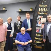 'We salute you!': Alfred Conway (centre) with (from left) his son-in-law Andrew Pretty and daughter Josie, Mayor of Skegness Coun Jimmy Brookes, MP for Boston and Skegness Richard Tice, and Coun Danny Brookes, at Mooch in Skegness.