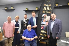 'We salute you!': Alfred Conway (centre) with (from left) his son-in-law Andrew Pretty and daughter Josie, Mayor of Skegness Coun Jimmy Brookes, MP for Boston and Skegness Richard Tice, and Coun Danny Brookes, at Mooch in Skegness.