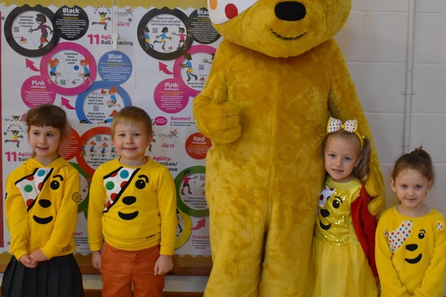 Pudsey Bear greets smiling youngsters at Staniland Academy, Boston.