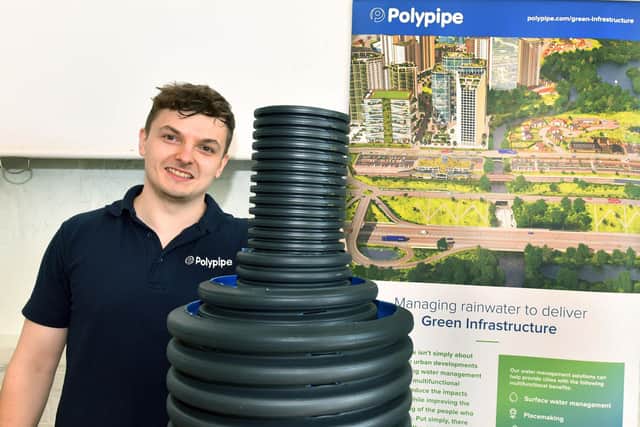Kamil from PolyPipe demonstrating their rainwater system.