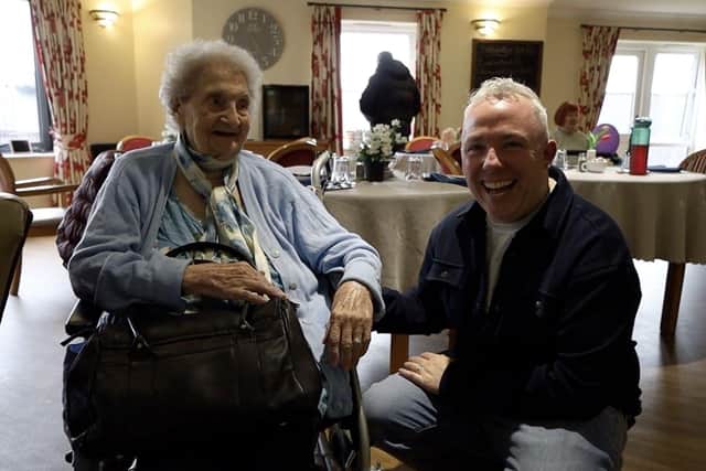 John Sweeney from Drop Dead Generous with an elderly resident at Cloverleaf Care Home