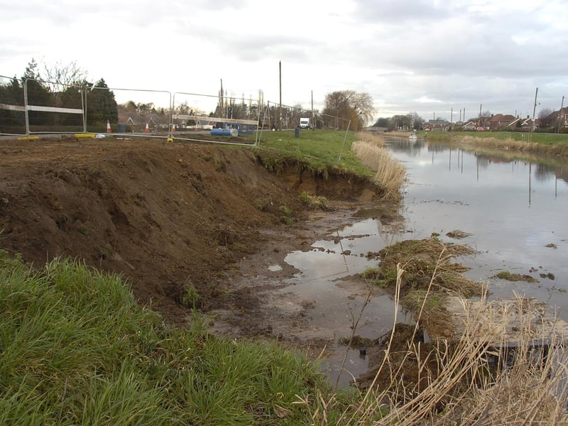 The scene along the Maud Foster Drain in Horncastle Road, Boston, following a burst water main. Almost two years earlier, a burst water main in the same area caused part of the road to collapse into the waterway.