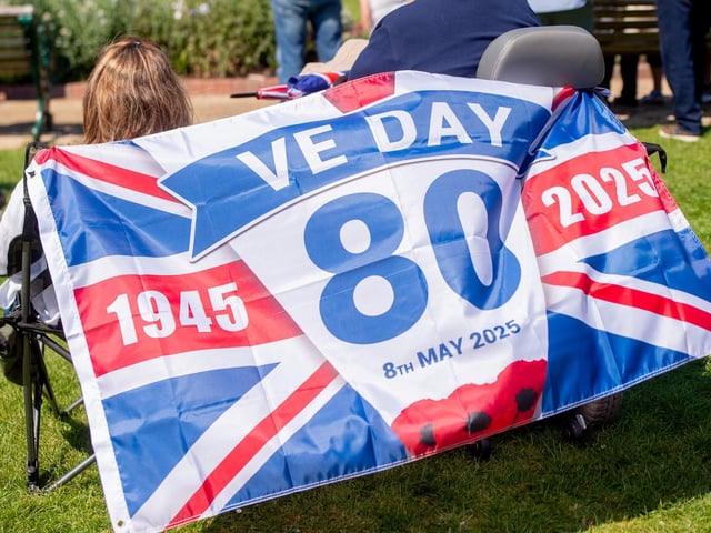 Spectators flying the flag for the Skegness VE/VJ 80 Picnic in the Park.