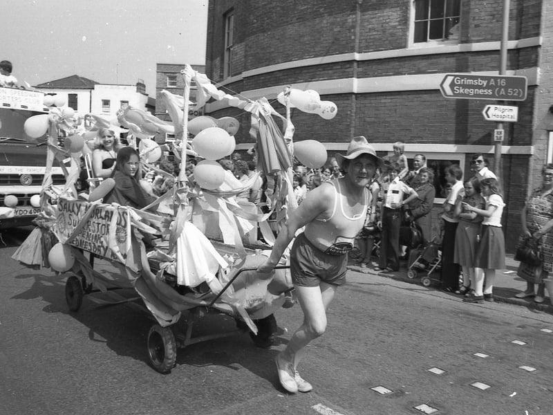 'Sally Morland's superstore opening Wednesday' reads the float.