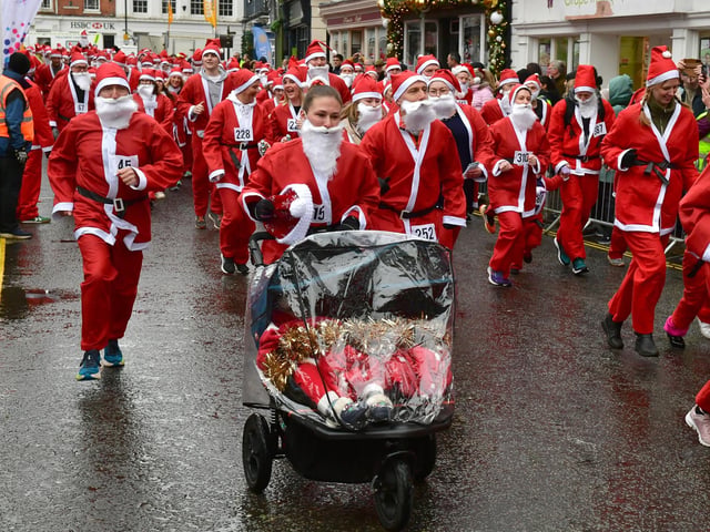 Even a mum with a pushchair joined in the festive fun to raise money for Cancer Research UK.