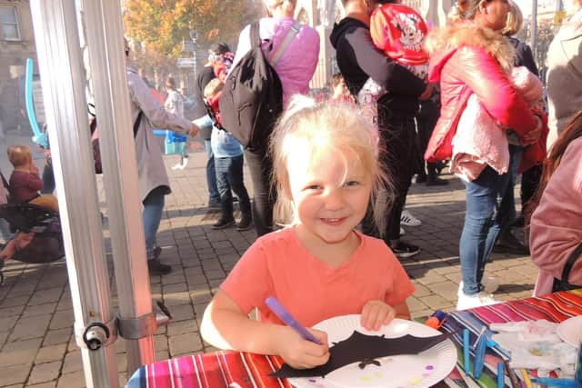 Craft activities. Decorating her plate with a bat, Emma Winlove-Smith, five, of Boston.