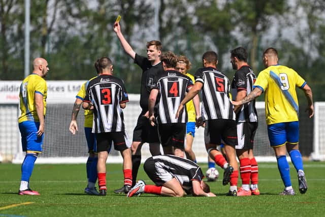 A yellow card is shown during Brigg's defeat by Bottesford. Picture by Anna Bäckström.