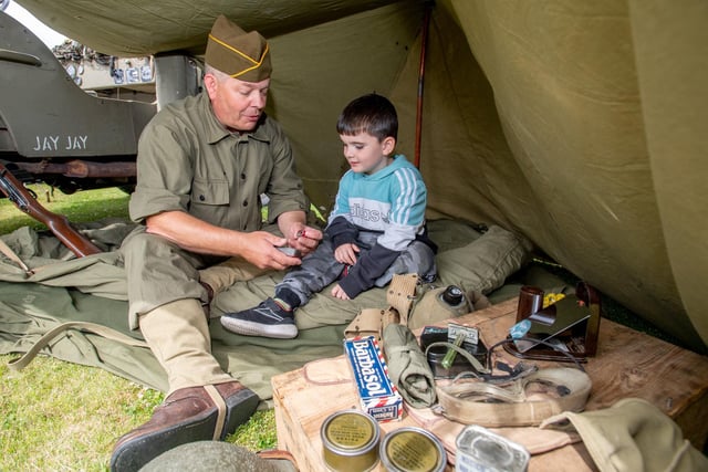 Ezra Hinchley, aged four, with Clive Flech, reconnaissance group living history group.
