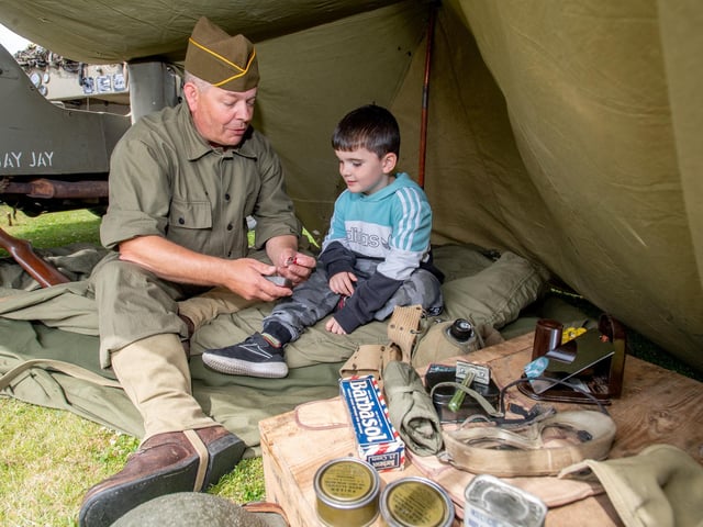 Ezra Hinchley, aged four, with Clive Flech, reconnaissance group living history group.
