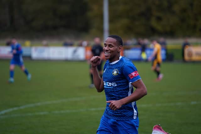 Sisa Tuntulwana celebrates Trinity's opener at Prescot Cables. Photo by Tommy Cox.