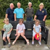 Pictured at the new bench, from left: Lions president Andrew MacKenzie , Lion Pete Wilson, Lion Malcolm Lamb and Lion Jayne Jacklin with local children.