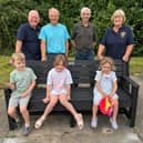 Pictured at the new bench, from left: Lions president Andrew MacKenzie , Lion Pete Wilson, Lion Malcolm Lamb and Lion Jayne Jacklin with local children.