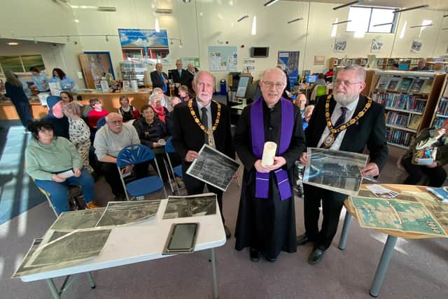 Deputy Mayor Paul Russell, Rev. Peter Lilley, and Mayor Steve Holland, lead a service of rememberance at Mablethorpe Library marking the 70th Anniversary of the 1953 floods.