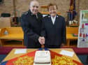 Pat and John Barrett cutting their anniversary cake