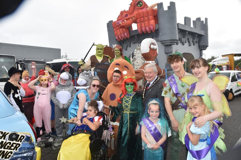 Mayor of Skegness Coun Pete Barry, Carnival Royalty and some of the characters in the parade.