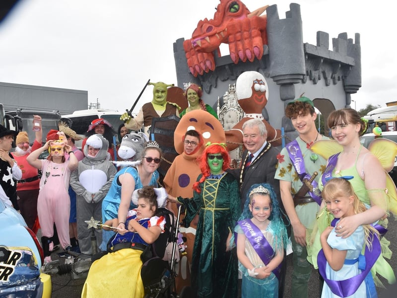 Mayor of Skegness Coun Pete Barry, Carnival Royalty and some of the characters in the parade.