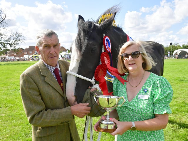 Heavy Horse parade. David Cosgrove with Hainton Crystal owned by Sue Cosgrove and Morris Poucher of Gautby. Overall Champion. With show general secretary Sarah Grant.