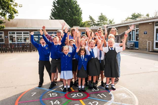 Children of Pinchbeck East celebrate revamped playground.