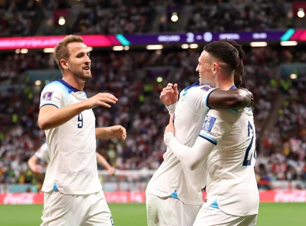 <p>Bukayo Saka celebrates with Harry Kane and Phil Foden after scoring England's third goal against Senegal (Photo by Catherine Ivill/Getty Images)</p>