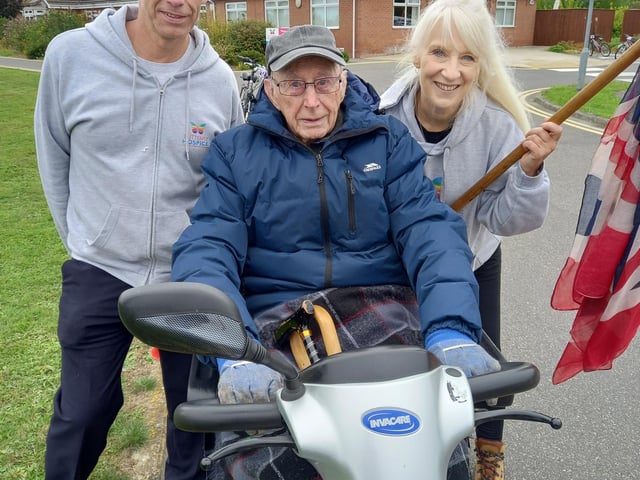 Participant Tony Appleby pictured on his scooter alongside Paul Caddell, hospice therapy services manager, and chief executive Bridget Macpherson. Images supplied