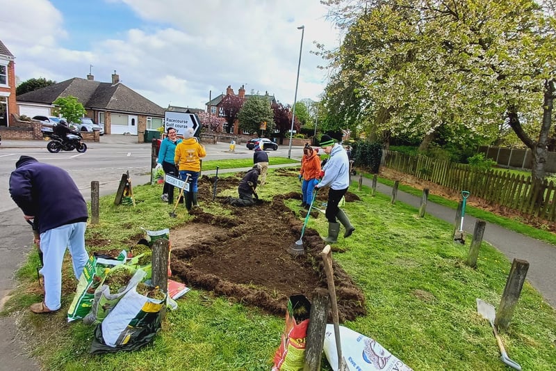 Volunteers cleared the area before sowing the seeds