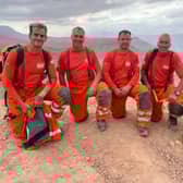 (L-R) Ben Clarke, Darren Burchnall, Karl Keuneke and Neil Woodmansey with Colin the rescue dog in Morocco.