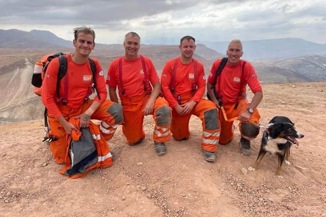 (L-R) Ben Clarke, Darren Burchnall, Karl Keuneke and Neil Woodmansey with Colin the rescue dog in Morocco.