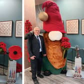 The giant 'gonk' at Cafe Noglish in Boston, and right, Council leader Coun Paul Skinner posing alongside the 9ft creation.