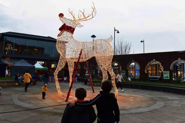Youngsters admiring the Christmas decorations at Marshall's Yard