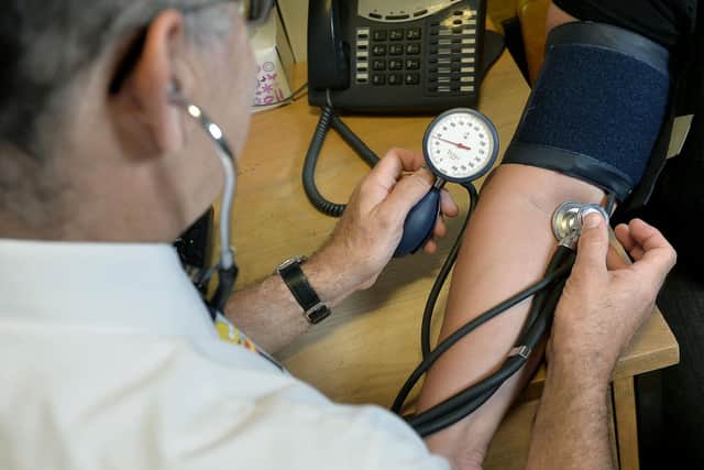EMBARGOED TO 0001 MONDAY JANUARY 2, 2023 File photo dated 10/09/14 of a GP using a stethoscope. Some sick people are resorting to do-it-yourself medical treatment because they cannot get a face-to-face appointment with a family doctor, according to new research. A survey by Savanta ComRes found that, in the past 12 months, more than one in four adults had tried to get an in-person consultation with a GP in their local area but were unable to do so. Issue date: Monday January 2, 2023.