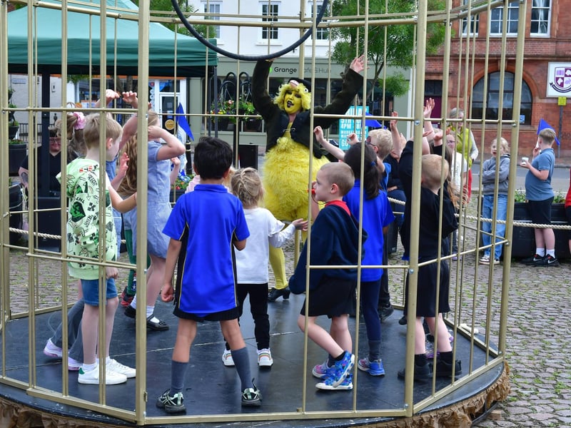 Children get in on the action inside the giant birdcage.