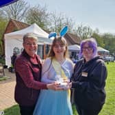 Summer Willetts presents a cheque for more than £1,000 to (from left) assistant manager and volunteer  Maxeen Andrew and manager Naomi Walton.