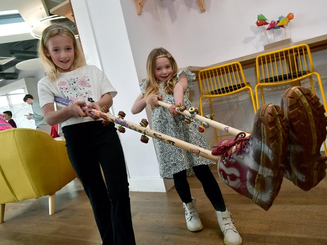 Bootstick making workshop with Band From County Hell. L-R Amber James 8 and Grace James 6 of Sleaford with their bootsticks