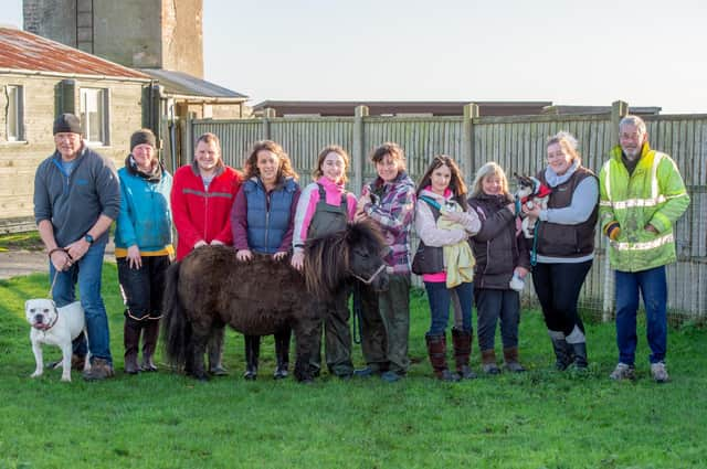 The Ark Animal Care team, from left: volunteer dog walker Clive , Lydia Ledgard, volunteer Tom, assistant manager Laura Wootton, Jess Barkhouse, Tracey Cashman, Emma Phillips, volunteer Doreen Reynolds, Sara Drage and dog walker Jim.