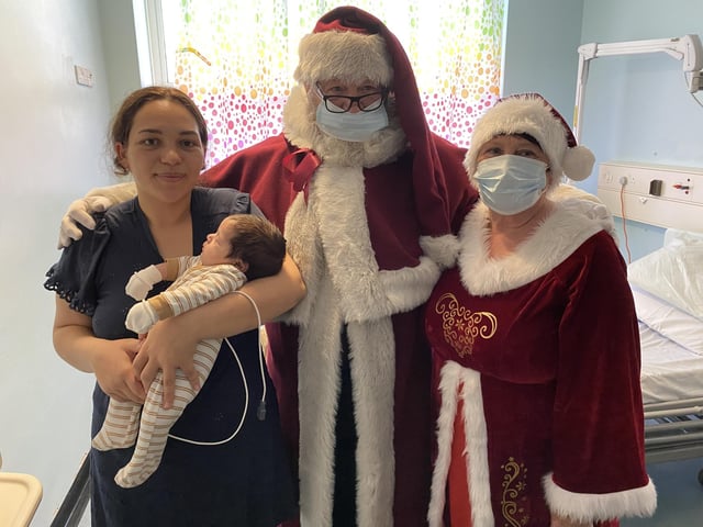Santa and his elves paid a visit to the children's wards at Pilgrim Hospital, Boston on Christmas Eve. Photo: ULHT